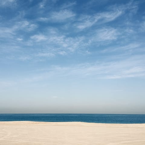 Stroll five minutes to Mina Seyahi Beach to soak up the sun on the sand