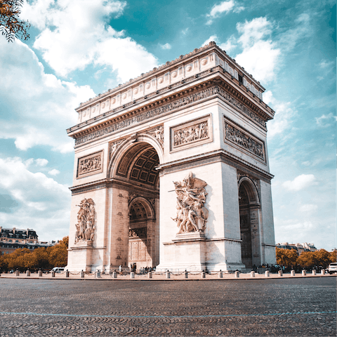 Admire the Arc de Triomphe, a short metro ride away