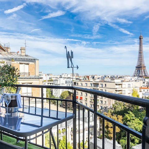 Watch the Eiffel Tower glitter as you sip a glass of bubbly on the balcony