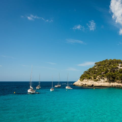 Take a trip to the turquoise waters at one of Menorca's sandy beaches 