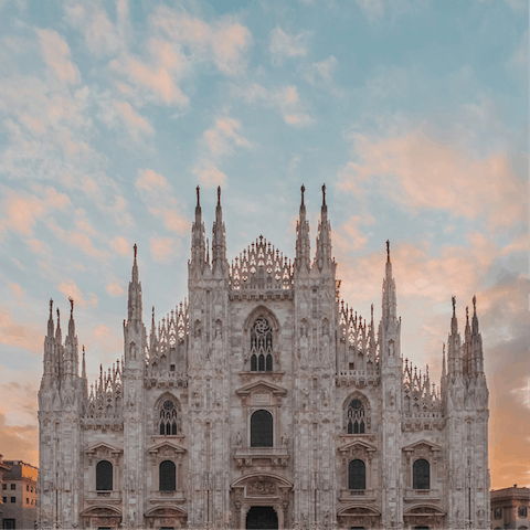 Wake up early for a sunrise visit to the Duomo di Milano, seven minutes away