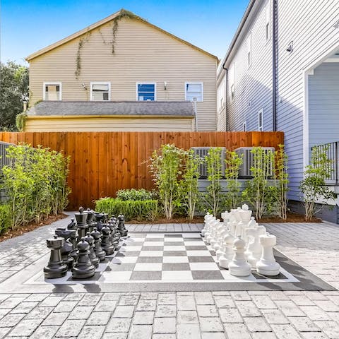 Unleash your competitive side with a game of oversized chess in the communal courtyard