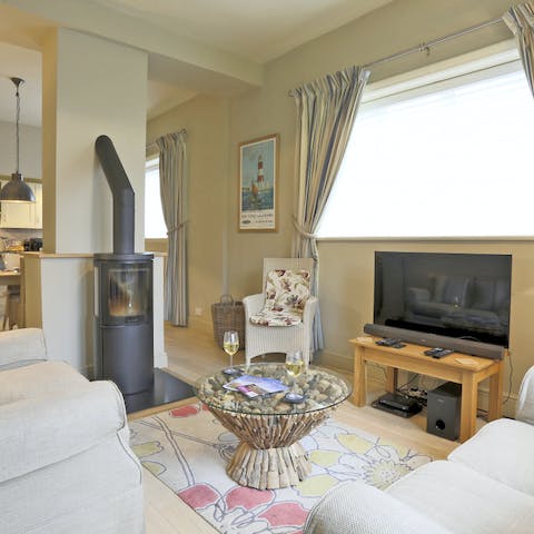 Have a cosy movie night next to the modern fireplace