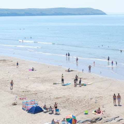 Make the most of warm summer days and head to the sandy beach just moments from the home