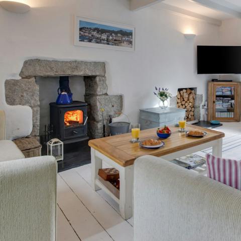Relax in front of a roaring fire after a day on the beach 