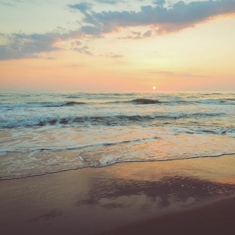 Stroll along the sandy shores of Santa Maria del Focallo Beach, just a 300m walk away