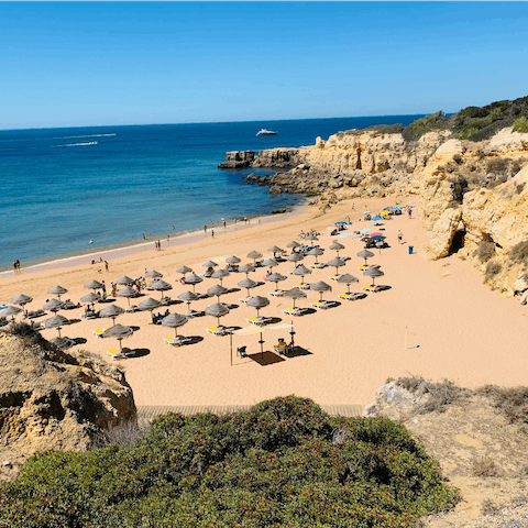 Pack your beach essentials and take the short, ten-minute walk down to Praia Grande for a spot of sunbathing on the golden sands