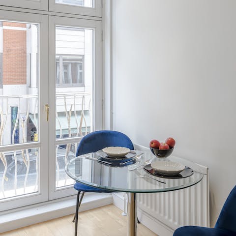 Plan the morning's agenda over breakfast from the window-side dining table