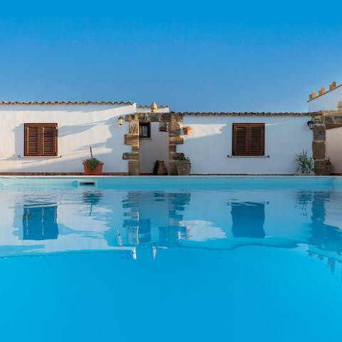 Swim laps in the pristine swimming pool at the heart of the home