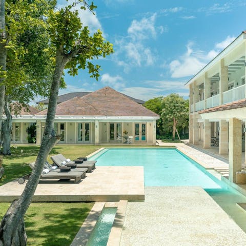 Feel an idyllic state of relaxation whilst lounging by the pool