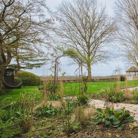 Admire far-reaching countryside views from the stunning garden