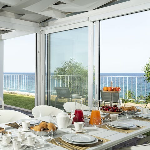 Start your day with a lavish breakfast and admire the sea views