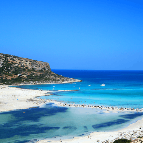 Explore the stunning Crete coastline, with its white sands and turquoise blue seas