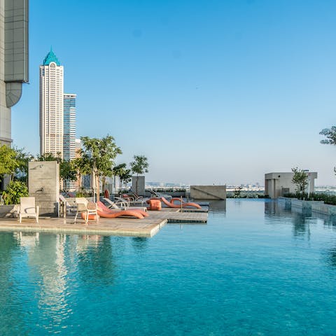 Plunge into your complex's pristine infinity pool to cool off from the Dubai sun
