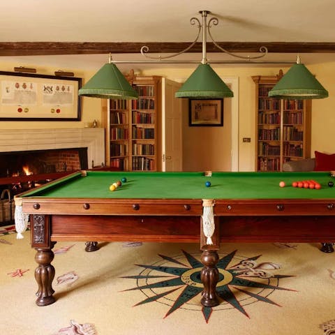 Play a game of pool in the billiards room