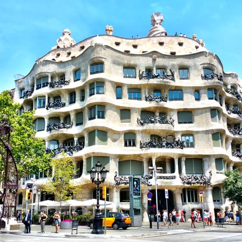 Check out Gaudi's work at Casa Mila – it's a short walk away