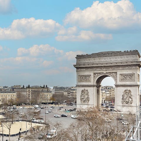 Admire views of the Arc de Triomphe from the balcony