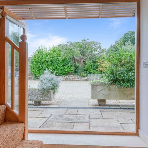 Open the glass folding doors to blend inside with outside