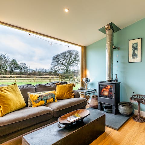 Lose yourself to the countryside views beside the fire