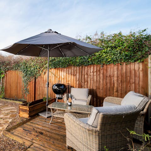 Fire up the barbecue for sunny evenings on the terrace –  the LED lit parasol and outdoor lights will help keep the night flowing outside