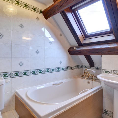 Sip on a glass of wine as you enjoy a bubble bath