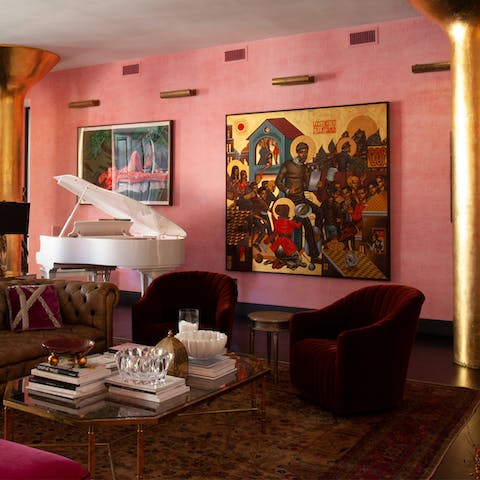 Admire the home's rich colours, velvet furnishings and original art pieces
