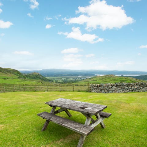 Watch the sun set over the rugged landscape as you sip a glass of wine at the picnic bench