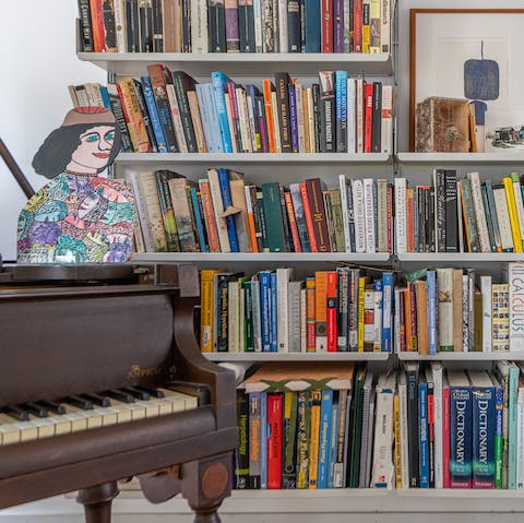Relax in the evenings with a book from the home library or a tickle on the ivories