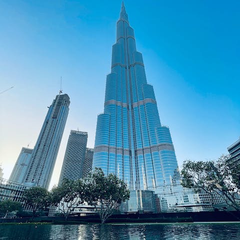 Take in the majestic views of the towering Burj Khalifa, a fifteen-minute drive away