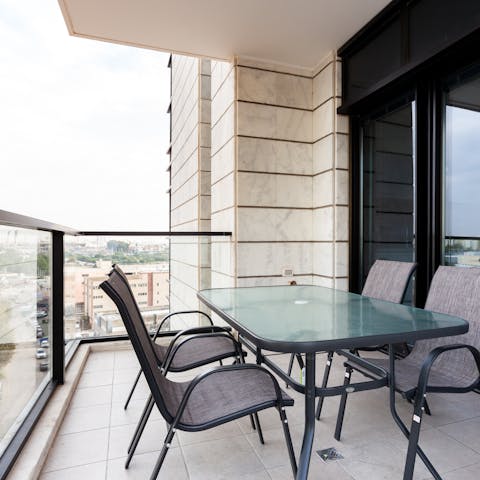Enjoy an alfresco dinner on your private balcony