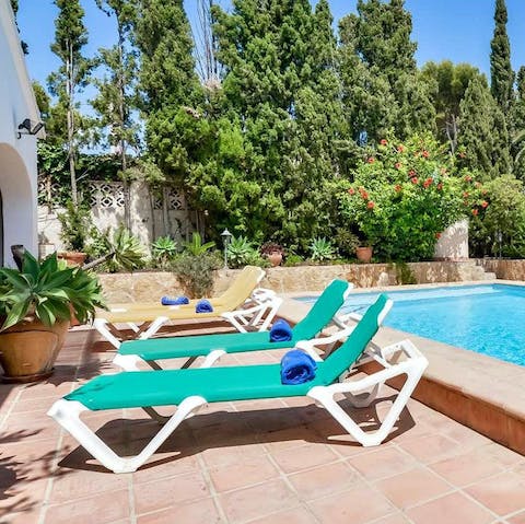 Relax and have a nap on the poolside sun loungers
