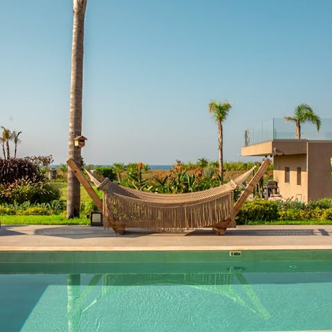 Take a good book out to the poolside hammock for an afternoon of lounging