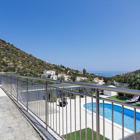 Enjoy the stunning views of the surrounding hills and the sea from your balcony