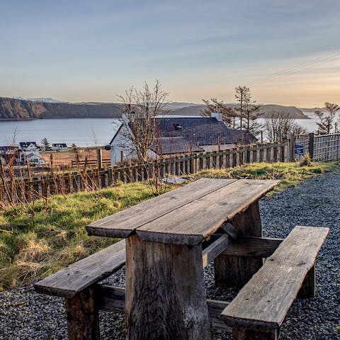Gather around the picnic table and watch the sun go down over the bay