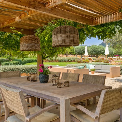 Dine alfresco with your loved ones beneath the pergola