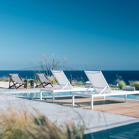 Enjoy a dip in the pool before lounging on the chairs and watching the sunset