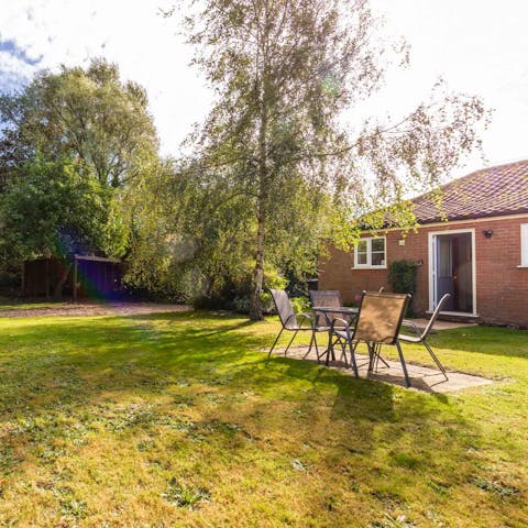 Enjoy a sunny alfresco lunch in the spacious private garden