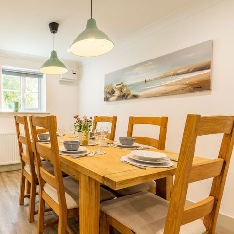 Sit down to a celebratory meal at the farmhouse-style dining table
