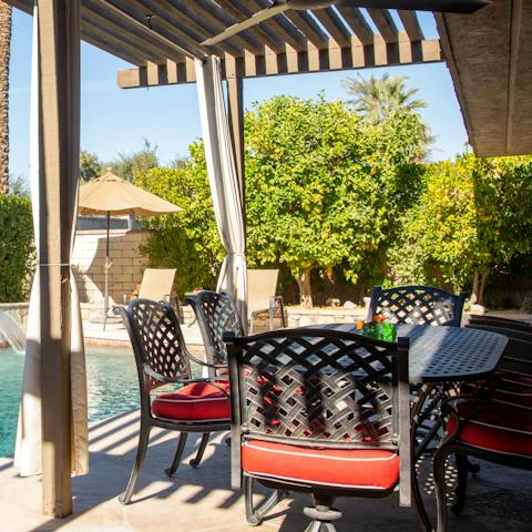 Enjoy dining al fresco in the shade of the pergola