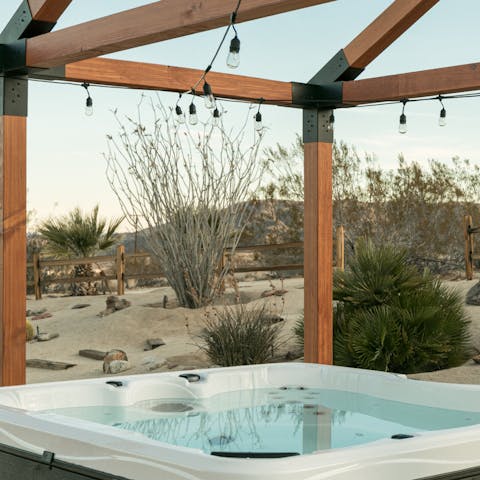 Relax in the hot tub beneath the stars