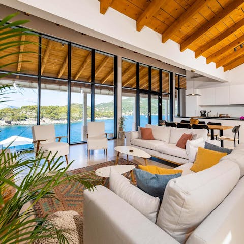 Gaze out to sea from the comfort of the glass-fronted living area