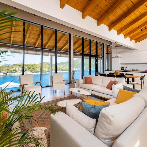 Gaze out to sea from the comfort of the glass-fronted living area