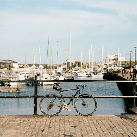Take a breezy stroll or cycle down to the ferry docks