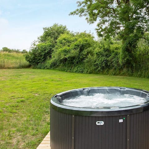 Spend evenings in the hot tub with views of the surrounding countryside