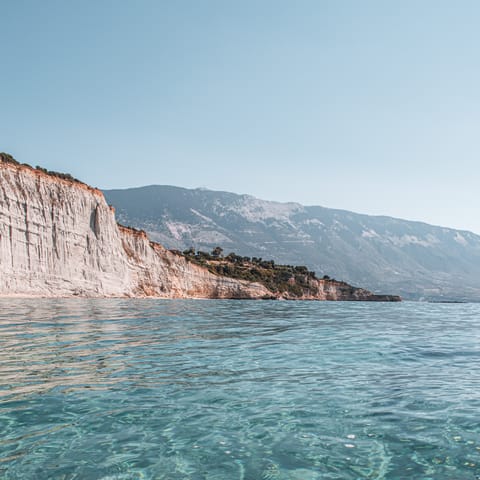 Paddle the clear waters off Plaka Beach, a short walk away