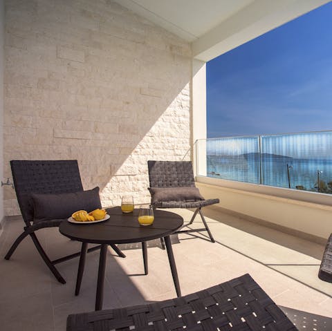 Sip your morning cuppa on the balcony as the sky comes alive  and the sea sparkles before you