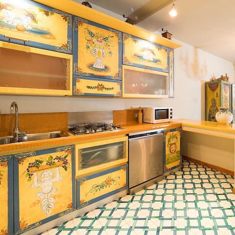 Whip up your favourite pasta dishes in the pretty painted kitchen