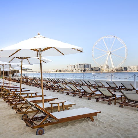 Step out onto JBR Beach and enjoy the golden sand underfoot