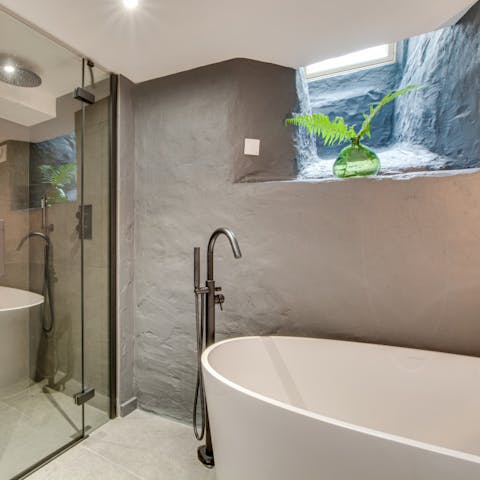 Treat yourself to a rejuvenating soak in the freestanding bathtub