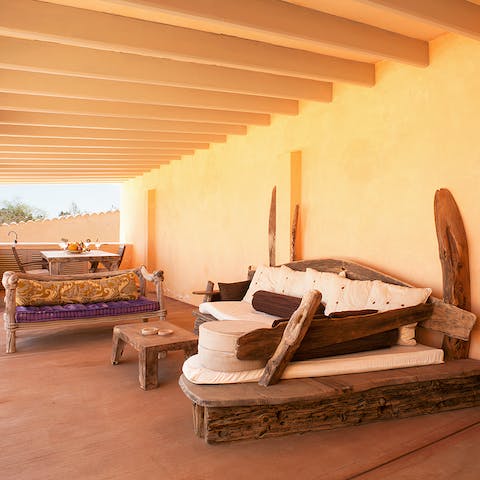Relax on the covered terrace with a glass of something chilled in hand